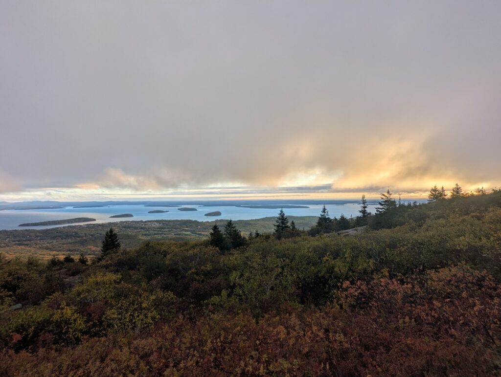Partial sunrise view from Cadillac Mountain overlooking Mount Desert Island in Acadia National Park